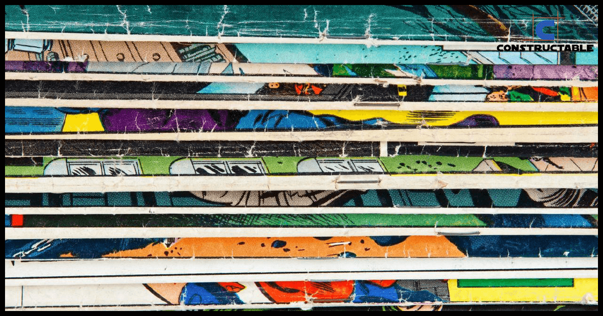A close-up photo of colorful, stacked comic books showing various layers of pages and graphics. The edges of the comics are worn and textured due to construction costs.