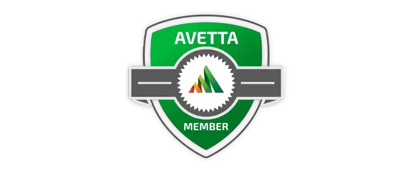 Logo of Avetta safety membership on a shield emblem, featuring a triangular green tree in the center with a grey ribbon labeled "member" across it, set against a black background.